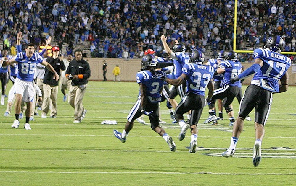 Jamison Crowder and teammates celebrate after the wide receiver caught a touchdown pass giving Duke a lead with less than a minute left.