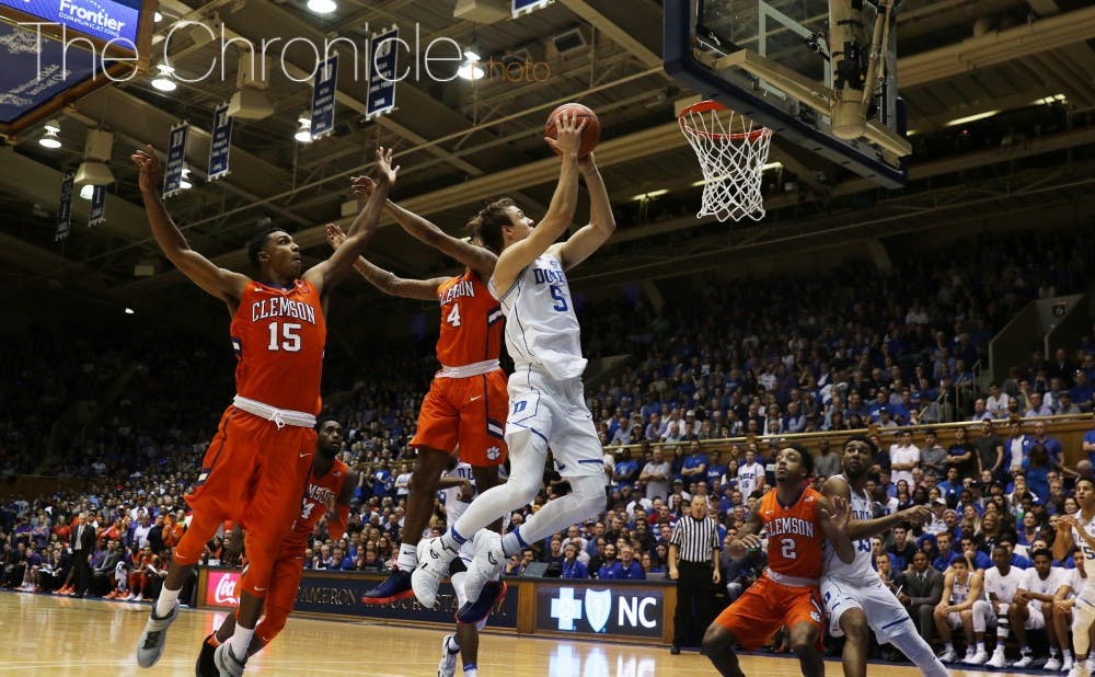Sophomore Luke Kennard scored 15 straight Blue Devil points in the second half as Duke withstood a furious Clemson rally.