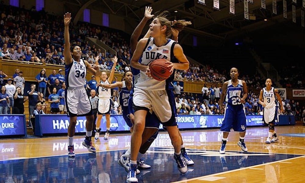 Freshman Allison Vernerey looks for space inside while Hampton’s 5-foot-4 guard Jericka Jenkins watches during Duke’s easy win Saturday.