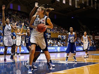 Freshman Allison Vernerey looks for space inside while Hampton’s 5-foot-4 guard Jericka Jenkins watches during Duke’s easy win Saturday.