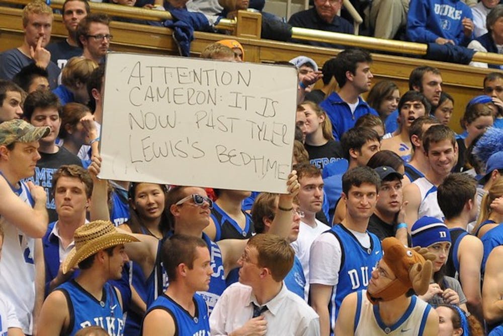 Photo from Duke Blue Planet shots of the actual cheer—"Past your bedtime"—though some people have ascribed all the Cameron Crazies to cheering "How's your grandmother" at Tyler Lewis, N.C. State's point guard whose grandmother passed away.
