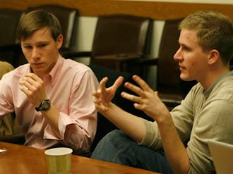 Campus Council President Stephen Temple (left) and Vice President Alex Reese (right) discuss revisions to the RGAC process at the group’s meeting Thursday night. Damage caused by individuals may negatively impact a group’s RGAC score in the future.