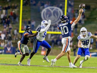 Duke's pass rushers pursue Anthony Colandrea during the Blue Devils' loss to Virginia.