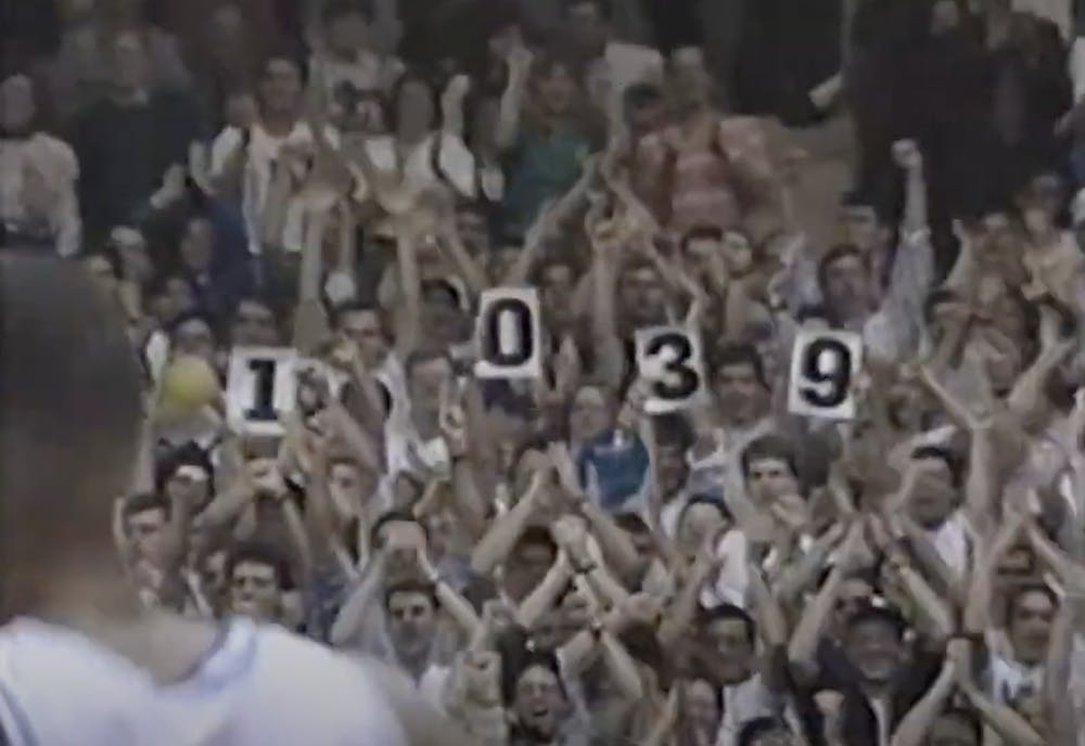 Mark Weinberg and his friends count Bobby Hurley's all-time assists at Duke's home game against Maryland in 1993.