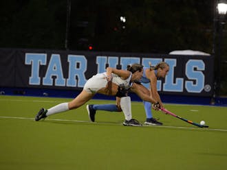 Sophomore Alaina McVeigh reaches for the ball during Duke's defeat to North Carolina.