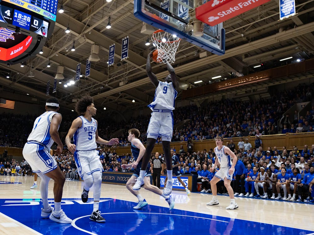 Freshman Khaman Maluach comes down with a rebound under the basket.