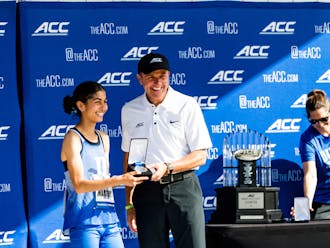 Amina Maatoug receives her silver medal after placing second at the ACC Championships.