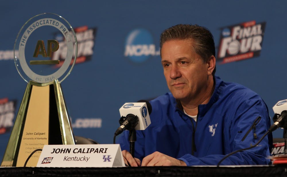 Kentucky head coach John Calipari picked up his AP Coach of the Year trophy at his Final Four press conference Friday afternoon.