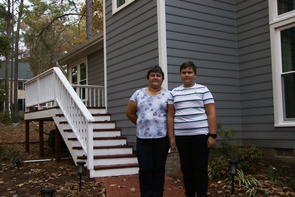 <p>Liuda Skorlupina and her son Zhenia outside of Liuda's friend's home in Durham, where they are now staying after fleeing the war in Ukraine.&nbsp;</p>