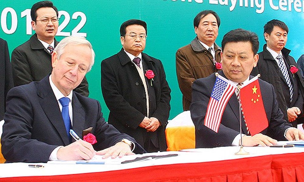 President Richard Brodhead signs an agreement finalizing Duke’s expansion plans in Kunshan, China Jan. 22. With the agreement, the University enters into a partnership with Shanghai Jiao Tong University, which is accused of being involved in a series of cyberattacks on Google last month.
