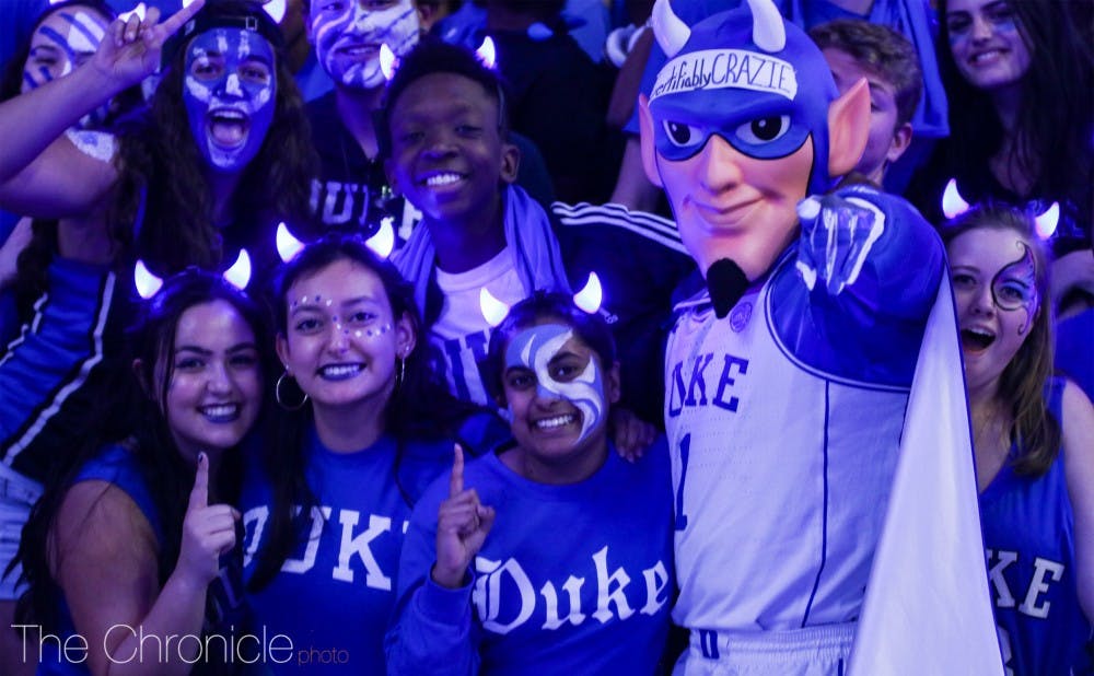 The mascot in 2018, posing with fans at Countdown to Craziness