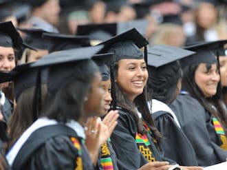 Students celebrate during the commencement ceremony Sunday in Wallace Wade Stadium. Cisco Systems CEO John Chambers delivered the commencement address.