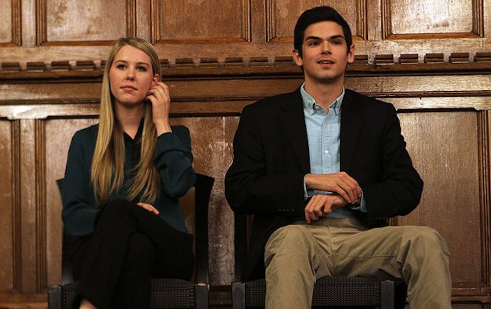Juniors Stefani Jones and Patrick Oathout, DSG presidential candidates, debate campus issues in the Great Hall Sunday evening.
