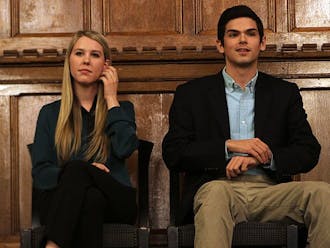 Juniors Stefani Jones and Patrick Oathout, DSG presidential candidates, debate campus issues in the Great Hall Sunday evening.