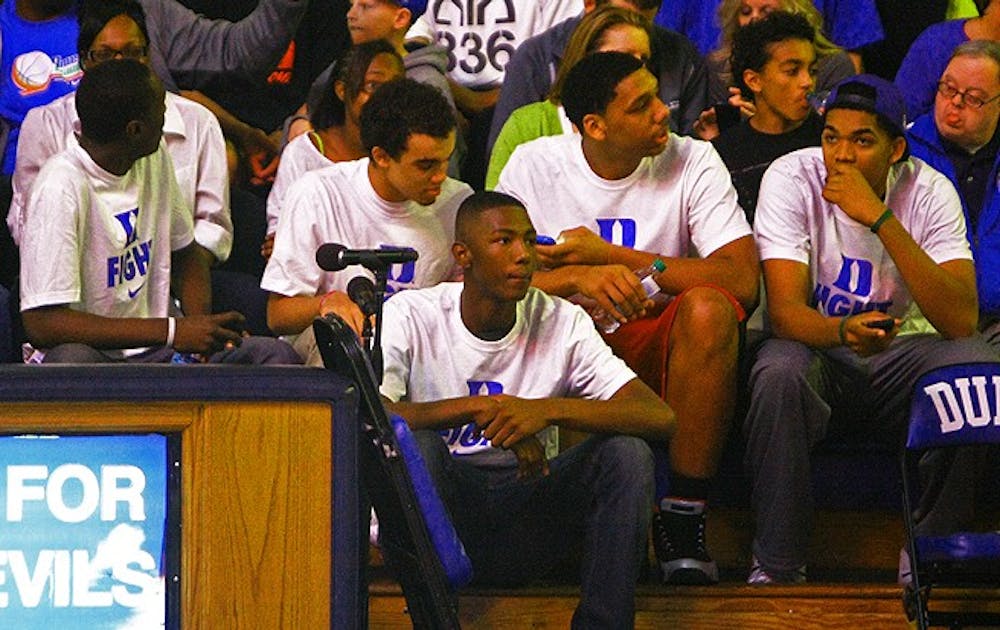 Top recruits sit behind Duke’s bench during Countdown to Craziness. Brady Buck covered recruiting for The Chronicle.