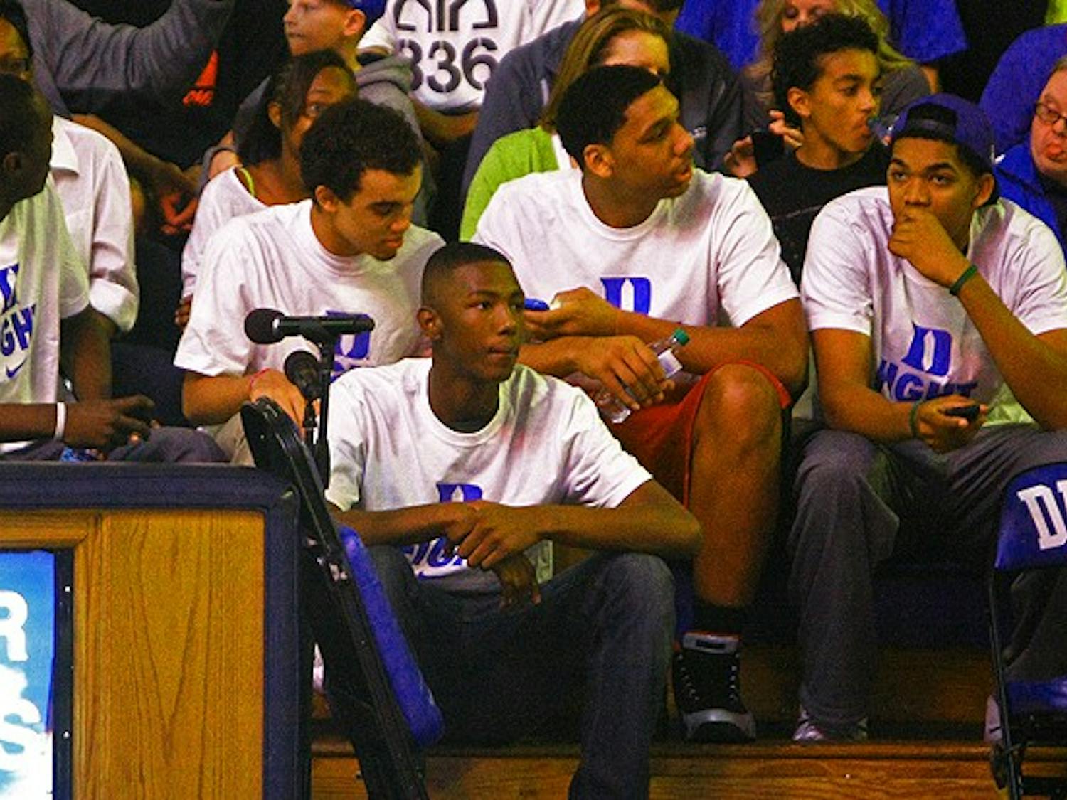 Top recruits sit behind Duke’s bench during Countdown to Craziness. Brady Buck covered recruiting for The Chronicle.