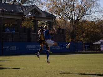 Duke's Ulfur Bjornsson and Western Michigan's Will Perkins both go up for the header. 