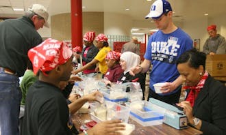 During the annual MLK Million Meals Service Event, local community members and Duke students pack meals for victims of the earthquake in Haiti. The volunteers packed a total of 50,000 meals Wednesday evening.