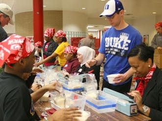 During the annual MLK Million Meals Service Event, local community members and Duke students pack meals for victims of the earthquake in Haiti. The volunteers packed a total of 50,000 meals Wednesday evening.