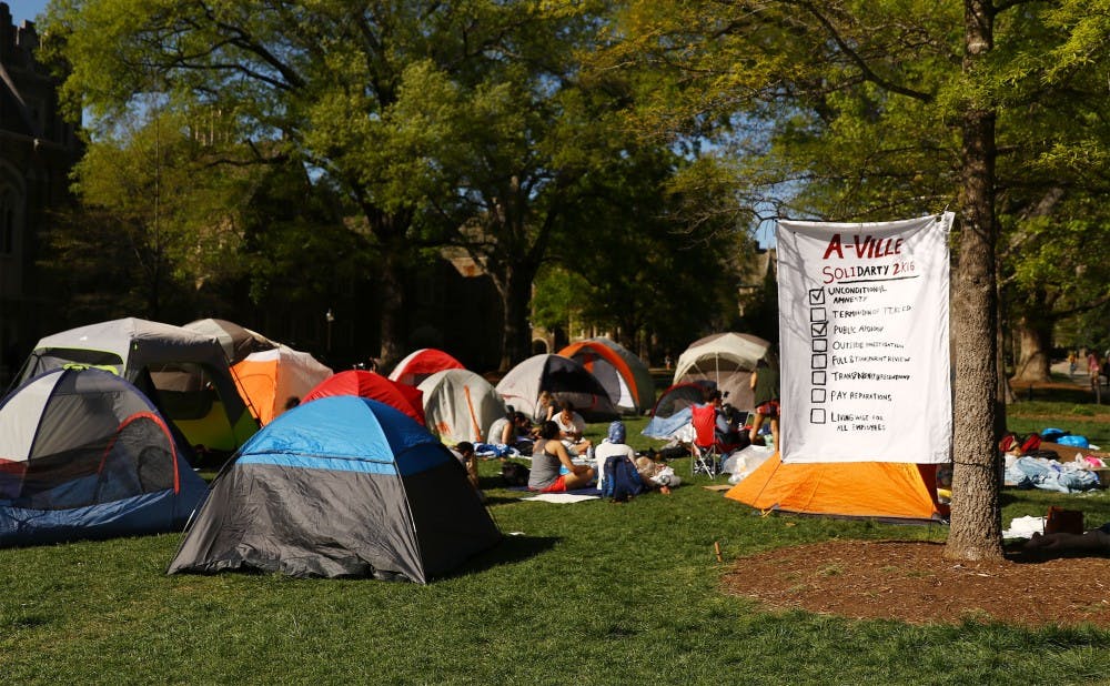 Students pitched tents in front of the Allen Building in support of protestors who staged a week-long sit-in inside the Allen Building in response to alleged instances of discrimination in the Parking and Transportation Services department.