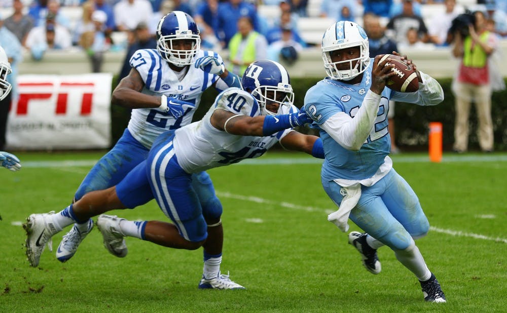 North Carolina quarterback Marquise Williams threw for 494 yards&mdash;404 in the first half&mdash;and accounted for five total touchdowns as the Tar Heels picked apart Duke's defense in a 66-31 win Saturday.