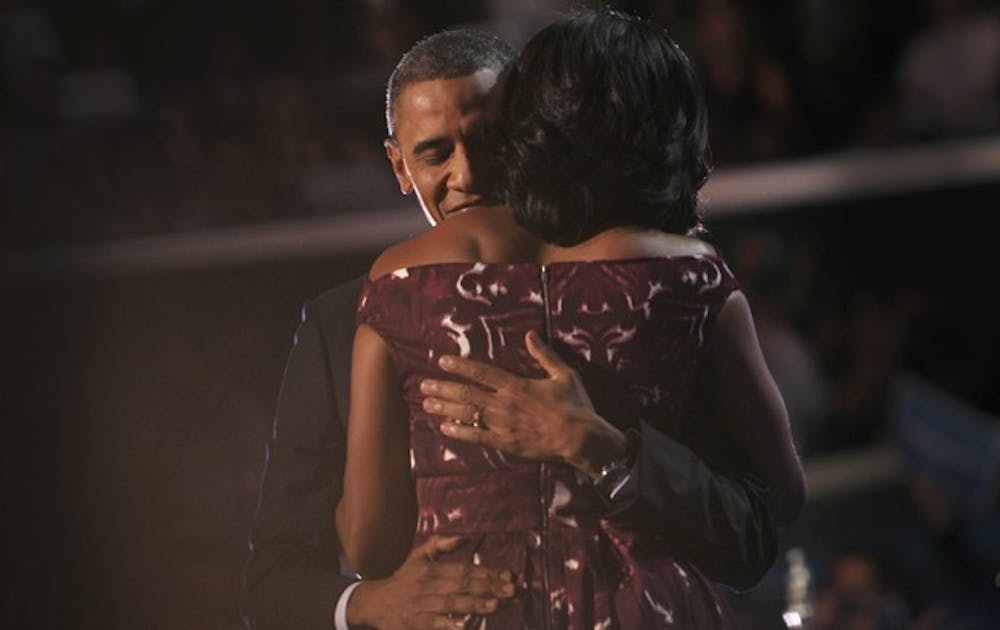 President Barack Obama  embraces his wife, first lady Michelle Obama, after he officially accepted the Democratic nomination for president at the Democratic National Convention in a speech Thursday night.
