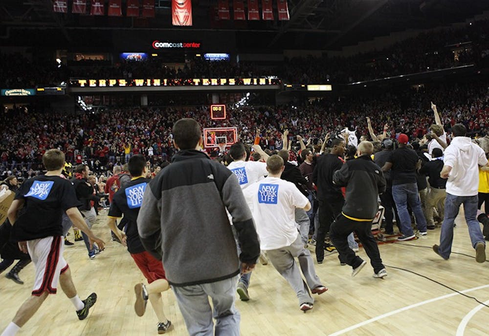 Maryland fans stormed the court following their team's 83-81 win over Duke.