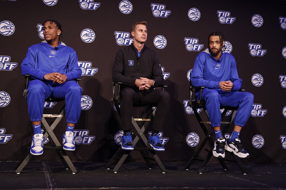 <p>Duke's Jeremy Roach (left), Jon Scheyer (center) and Jacob Grandison (right) at ACC Tipoff in Charlotte.</p>