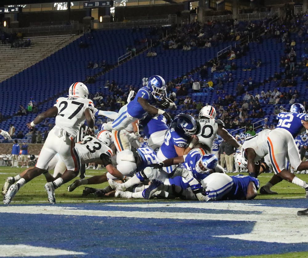 Jordan Waters leaps into the end zone in Duke's Oct. 1 win against Virginia for his fourth touchdown of the season.