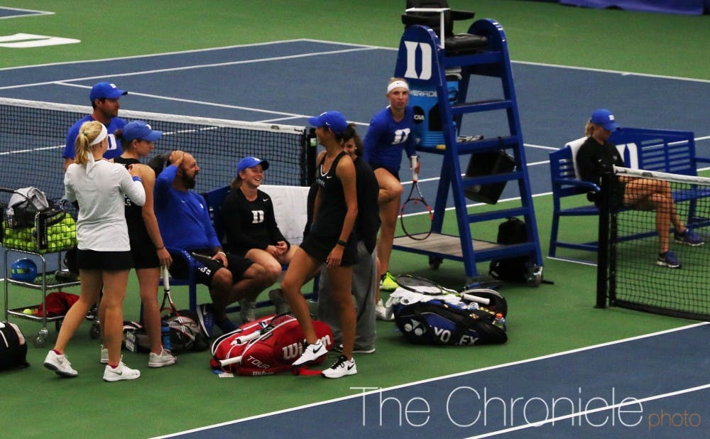 A rain delay of almost two and a half hours interrupted Friday's match between doubles and singles.