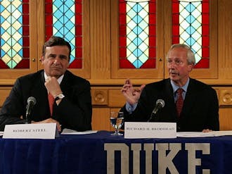 Former Board of Trustees Chair Robert Steel and President Richard Brodhead speak at a press conference in mid-2006, reinstating the men’s lacrosse season.