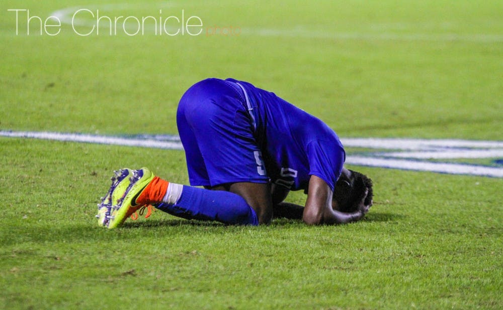 Several Blue Devils laid on the turf after Friday's hard-fought 2-1 loss to North Carolina.&nbsp;