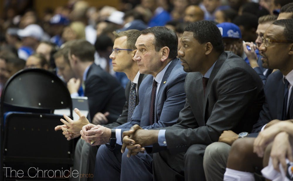 Associate head coach Nate James (third from left) provided some insight as to who could make up the Blue Devils' starting five to begin the season.