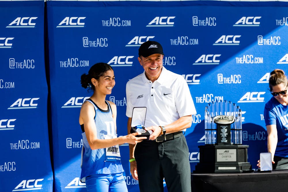 Amina Maatoug celebrates her second-place finish at the 2023 ACC Championships.