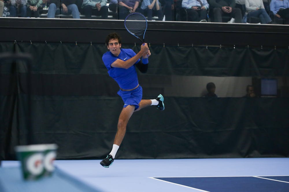 Pedro Rodenas leaps for a backhand during a 6-2, 6-2 win Saturday against North Carolina's Ryan Seggerman.