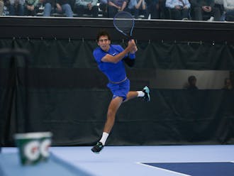 Pedro Rodenas leaps for a backhand during a 6-2, 6-2 win Saturday against North Carolina's Ryan Seggerman.