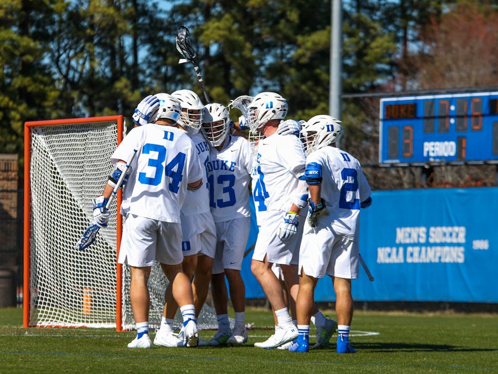 Duke players gather in front of their goal during a Feb. 4 win against Bellarmine.