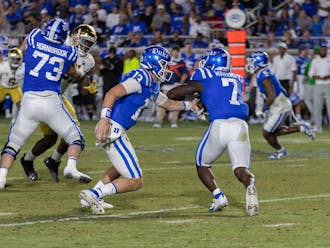 Riley Leonard hands the ball off to Jordan Waters during Duke's defeat to Notre Dame.