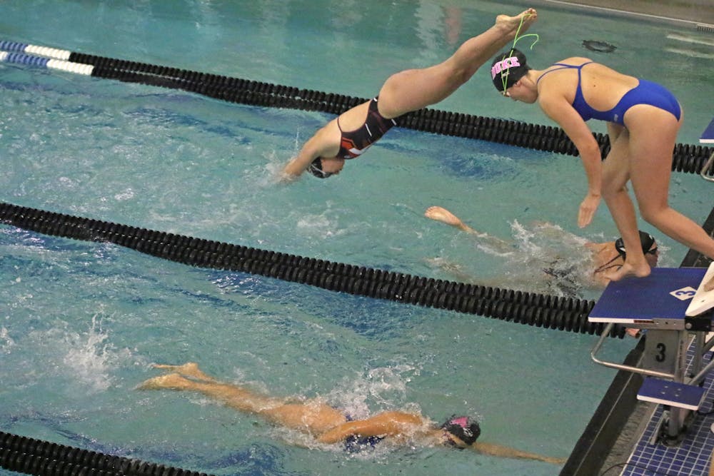 The Duke swimming and diving women's relay team races against Virginia Tech last season