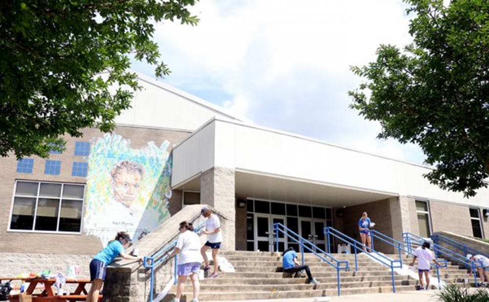 Duke alumni and retired faculty and staff members volunteered to help make repairs at Lakewood Elementary School this summer.