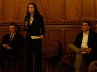 Young Trustee Finalists Zach Perret (left), Chelsea Goldstein (center) and John Harpham (right) participate in a public debate Wednesday night.