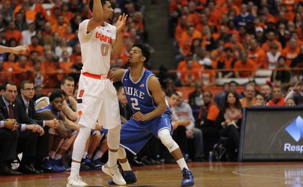 Quinn Cook helped to limit scoring opportunities for former Blue Devil Michael Gbinije in the second half of Duke's win at the Carrier Dome Feb. 14.