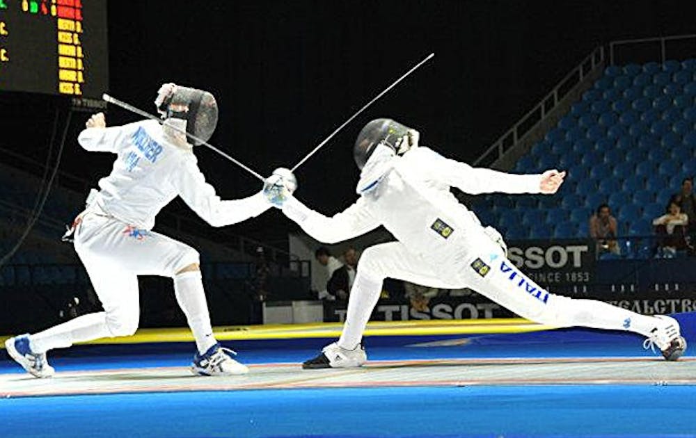 Duke fencer Dylan Nollner, left, defeats Italy’s Andrea Santarelli at the 2012 Junior World Championships.