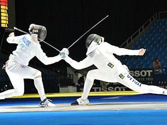 Duke fencer Dylan Nollner, left, defeats Italy’s Andrea Santarelli at the 2012 Junior World Championships.