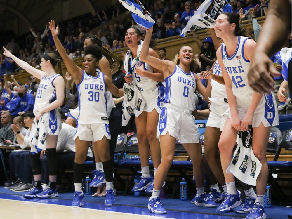 The Blue Devil bench celebrates during their home rout of Iona in the NCAA tournament Saturday night.