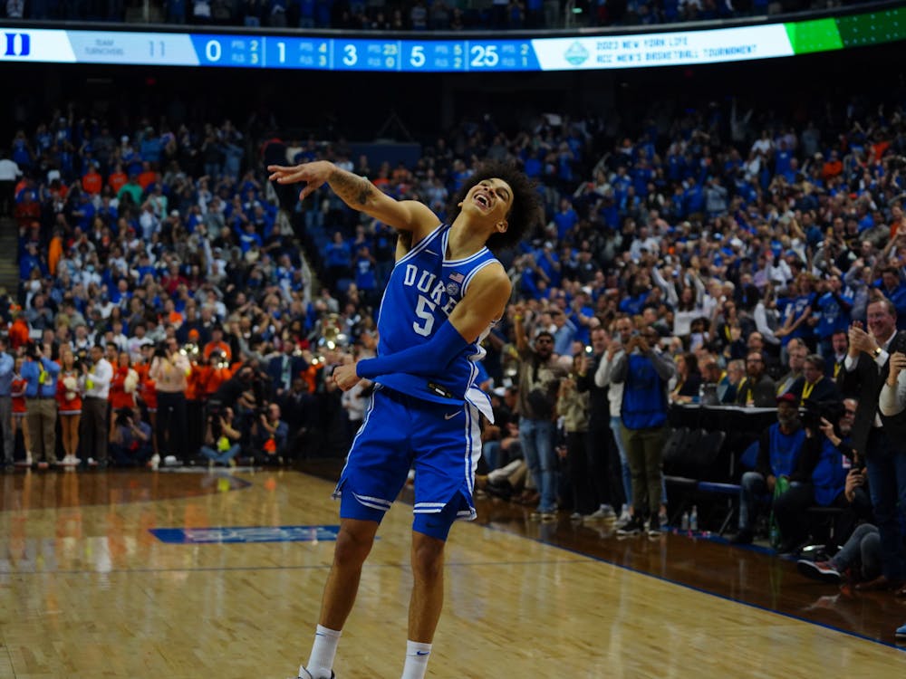 Tyrese Proctor grins as the buzzer sounds in Duke's ACC tournament championship win.