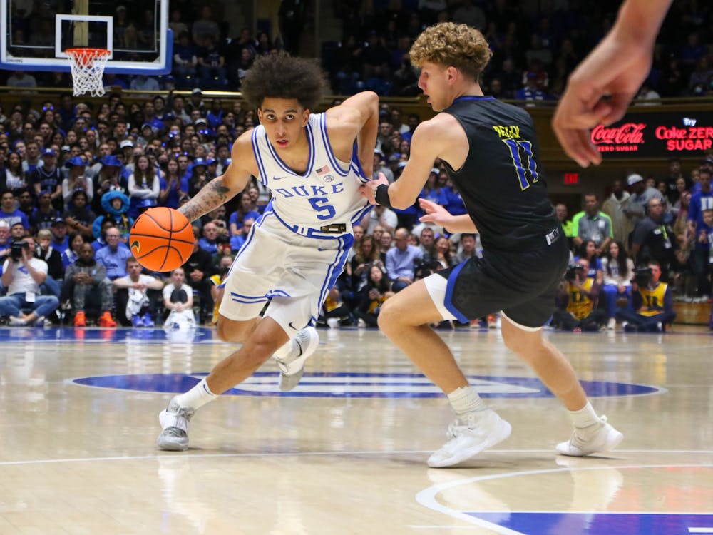 <p>Duke freshman guard Tyrese Proctor drives to the rim in the first half against Delaware at Cameron Indoor Stadium.</p>