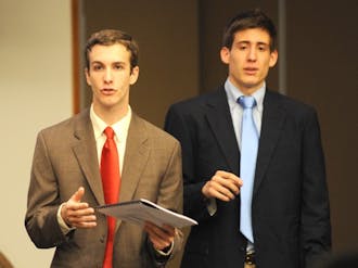 Seniors Justin Robinette, former Duke College Republicans chair, and Cliff Satell, former DCR vice chair, testify regarding DCR’s hostile atmosphere at the Duke Student Government meeting Wednesday night.
