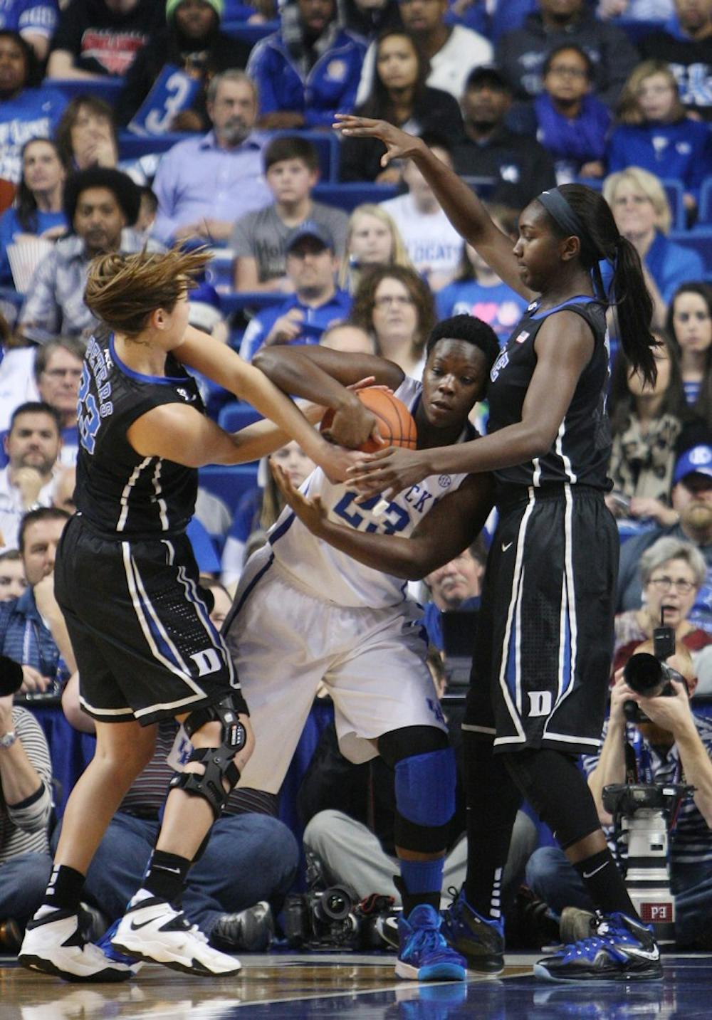 Duke forward Haley Peters (33) and center Elizabeth Williams (1) fight for the ball with UK forward Samarie Walker (23) during UK Hoops vs. Duke at Rupp Arena in Lexington, Ky., on Sunday, December 22, 2013. Photo by Emily Wuetcher | Staff 