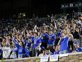 A full student section cheers on the Blue Devils against North Carolina.